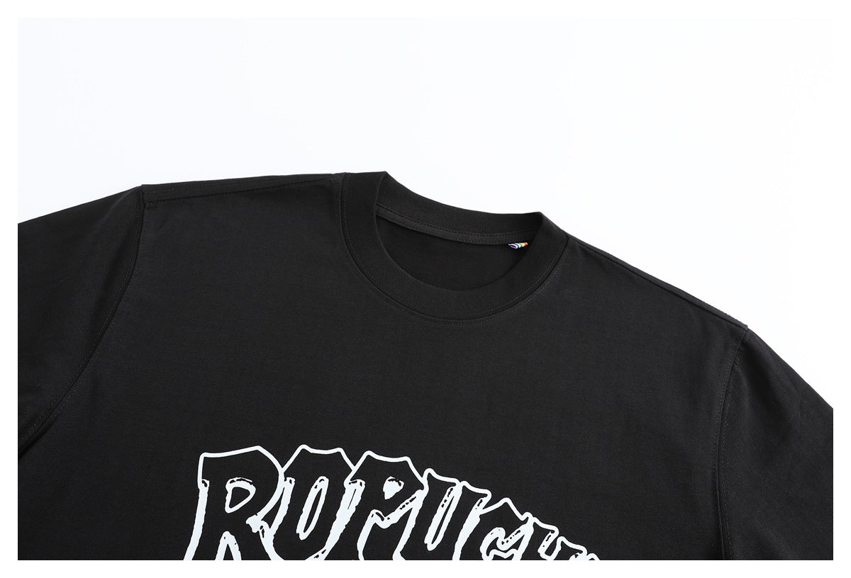 Close-up of a black crew-neck T-shirt with part of a large white outlined graphic print visible.