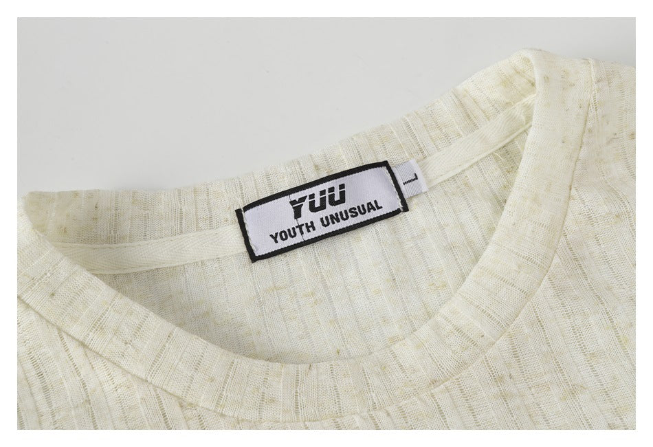Close-up of the ivory shirt's ribbed crew neck and sewn-in neck label.