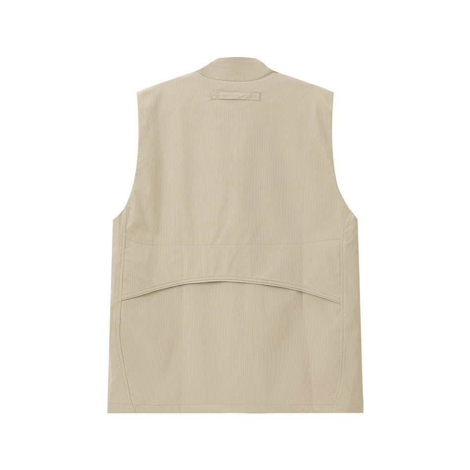 Back view of a light beige sleeveless vest with a stand collar and curved lower-back seam.
