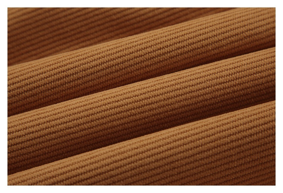 Close-up of parallel raised ribs in caramel-brown fabric.
