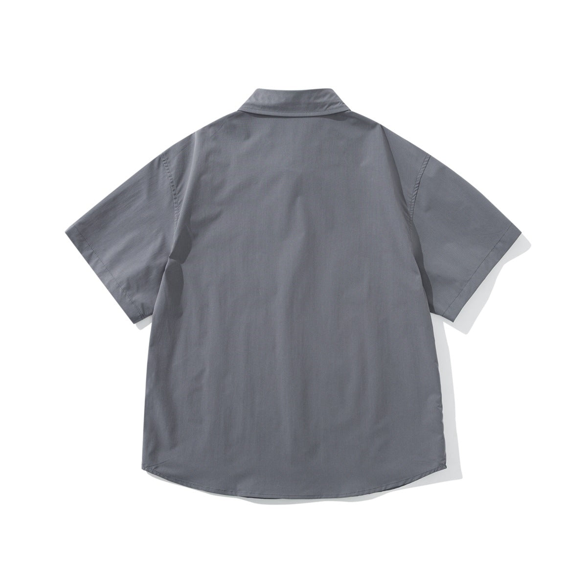 Back view of a plain gray short-sleeve button-up shirt with a pointed collar and curved hem, laid flat.