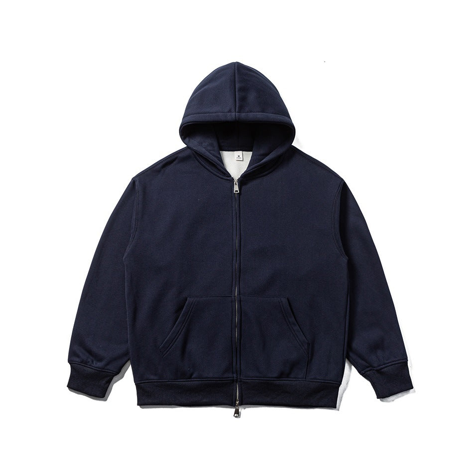 Navy zip-up hoodie jacket laid flat, with double-slider zip, front pocket and ribbed cuffs and hem