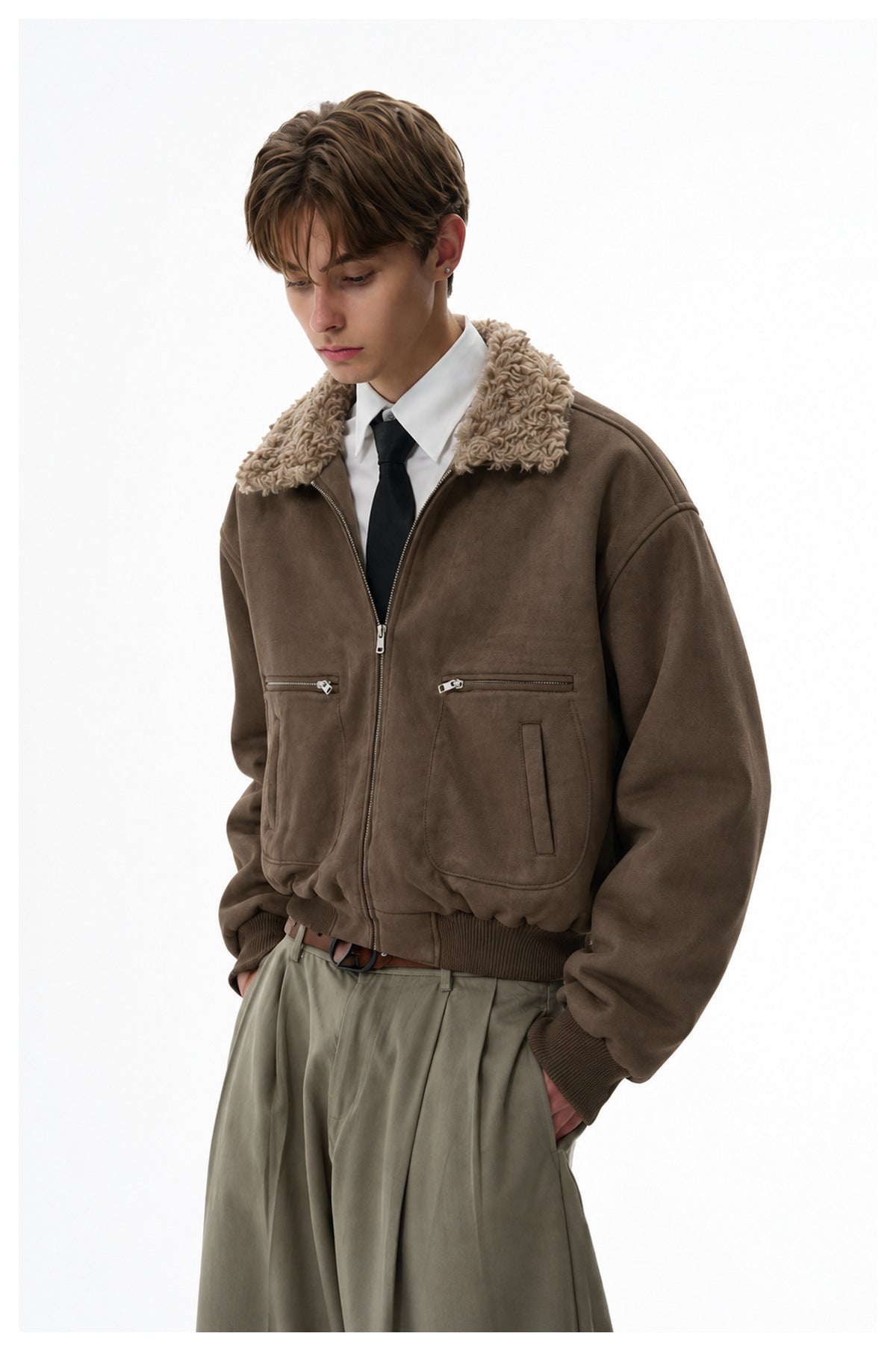 Model wearing a dark brown zip jacket with a plush tan collar, zip chest pockets, and ribbed cuffs and hem.