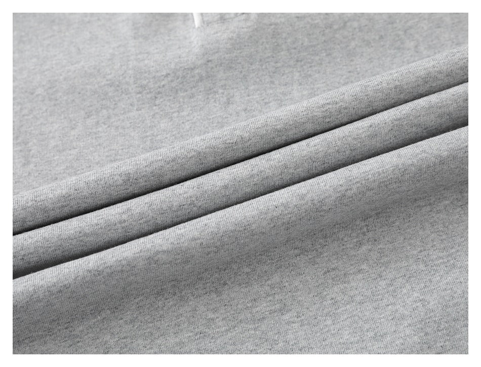 Close-up of heather-gray fabric arranged in soft folds.
