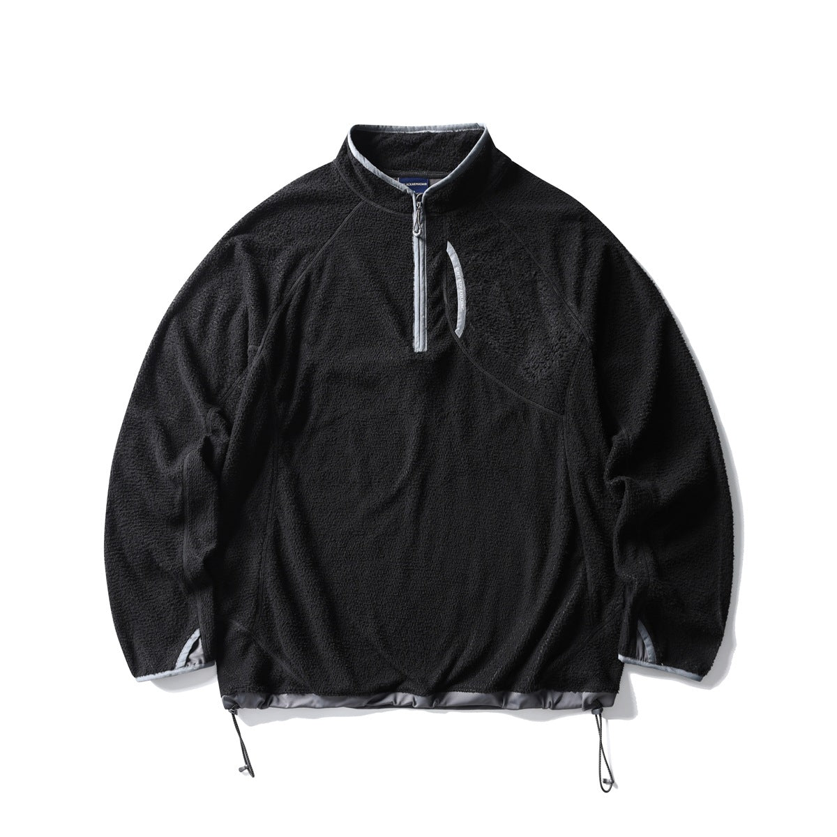 Black textured fleece-like half-zip pullover with gray trim and drawstring hem, flat lay front view
