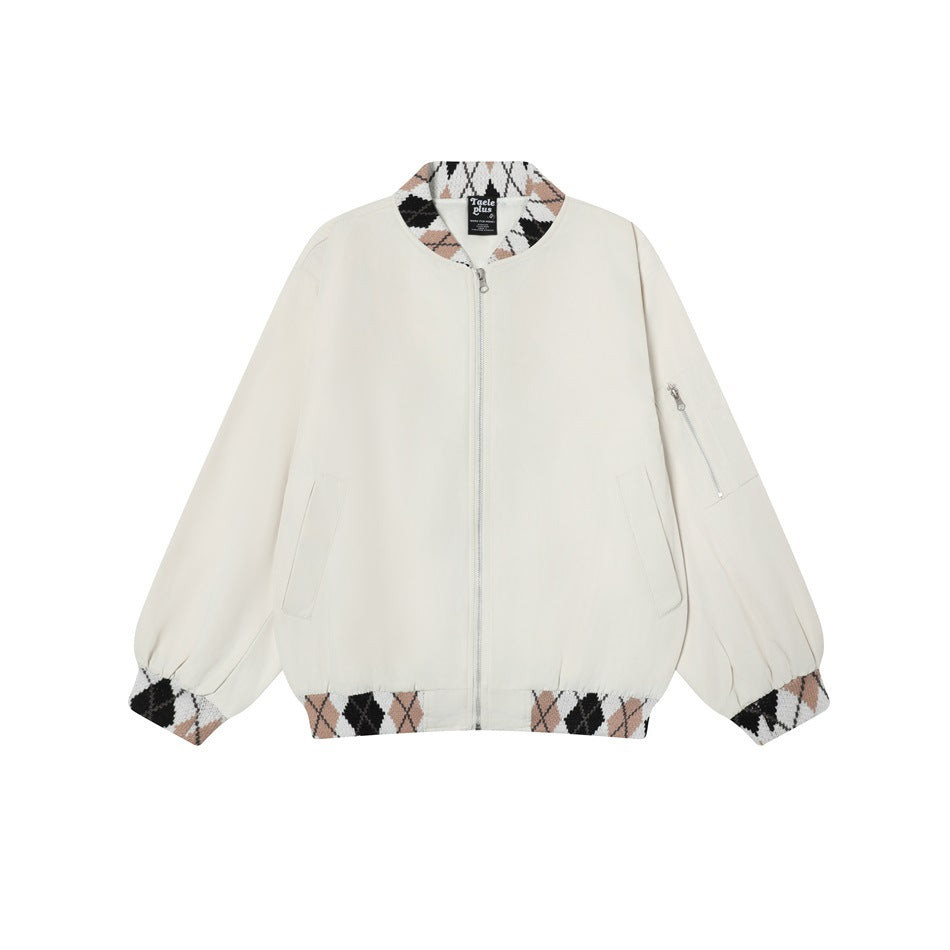 Apricot bomber-style zip jacket with argyle knit collar, cuffs and hem, front view on white background