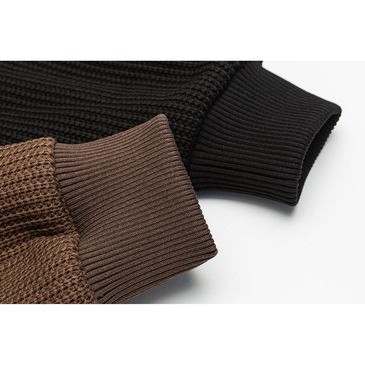 Close-up showing textured brown and black jacket sleeves with contrasting ribbed cuffs.