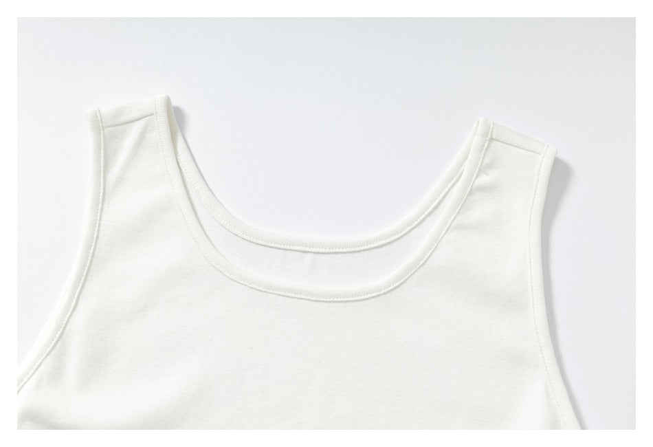 Close-up of a white sleeveless top showing its rounded neckline and shoulder straps.