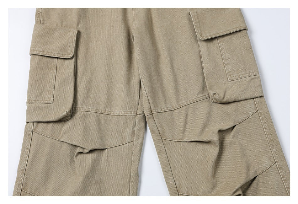 Close-up of khaki cargo pants showing large flap pockets and reinforced leg panels.