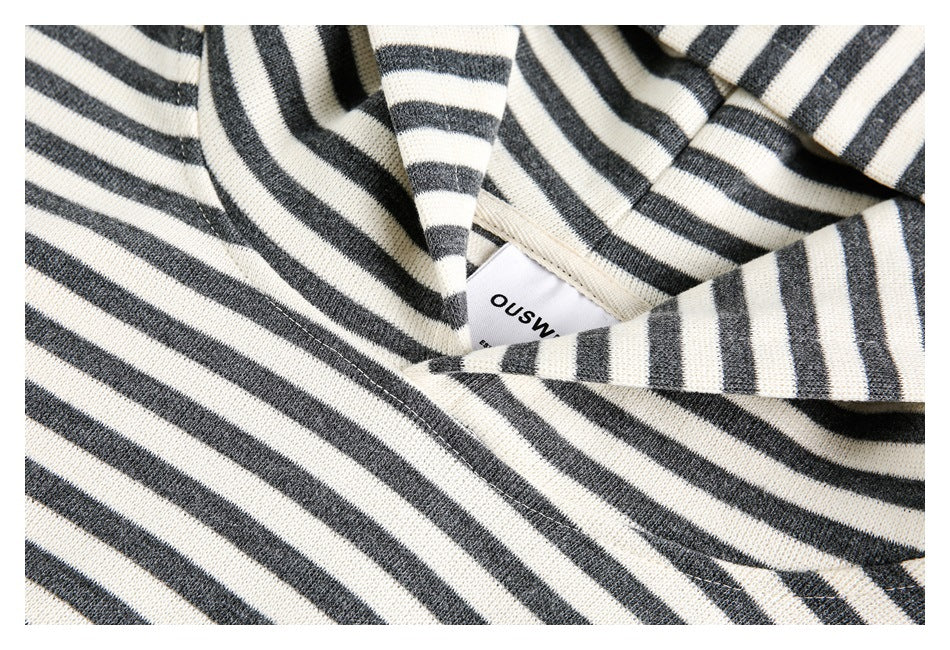 Close-up of the striped sweatshirt's neckline stitching and sewn-in label.