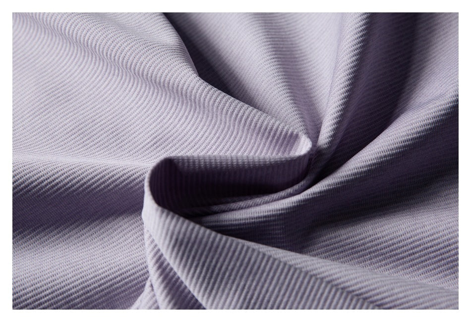 Close-up of lavender ribbed fabric draped into soft folds.