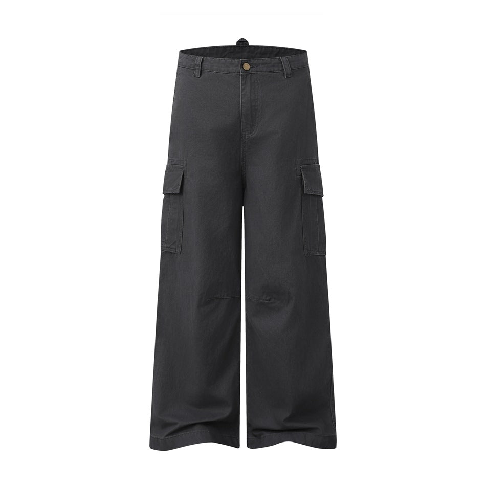 Dark gray wide-leg cargo pants with flap side pockets, belt loops and button fly, flat front view