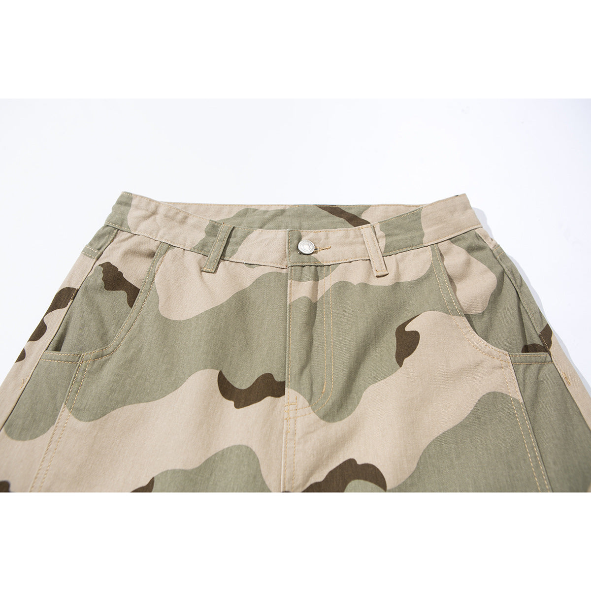 Close-up of the front waistband and pockets of beige, olive, and brown camouflage pants.