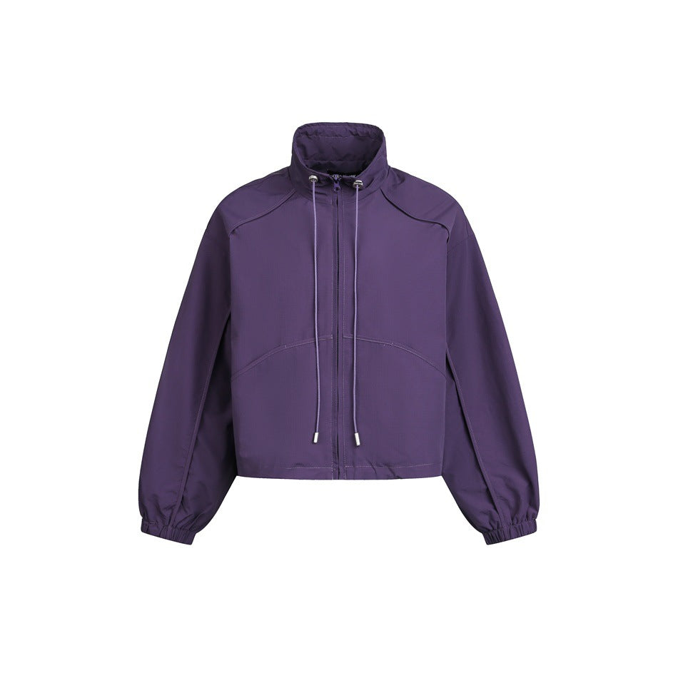 Purple cropped zip jacket with stand collar, drawstring cords, curved front seams and elastic cuffs on white background