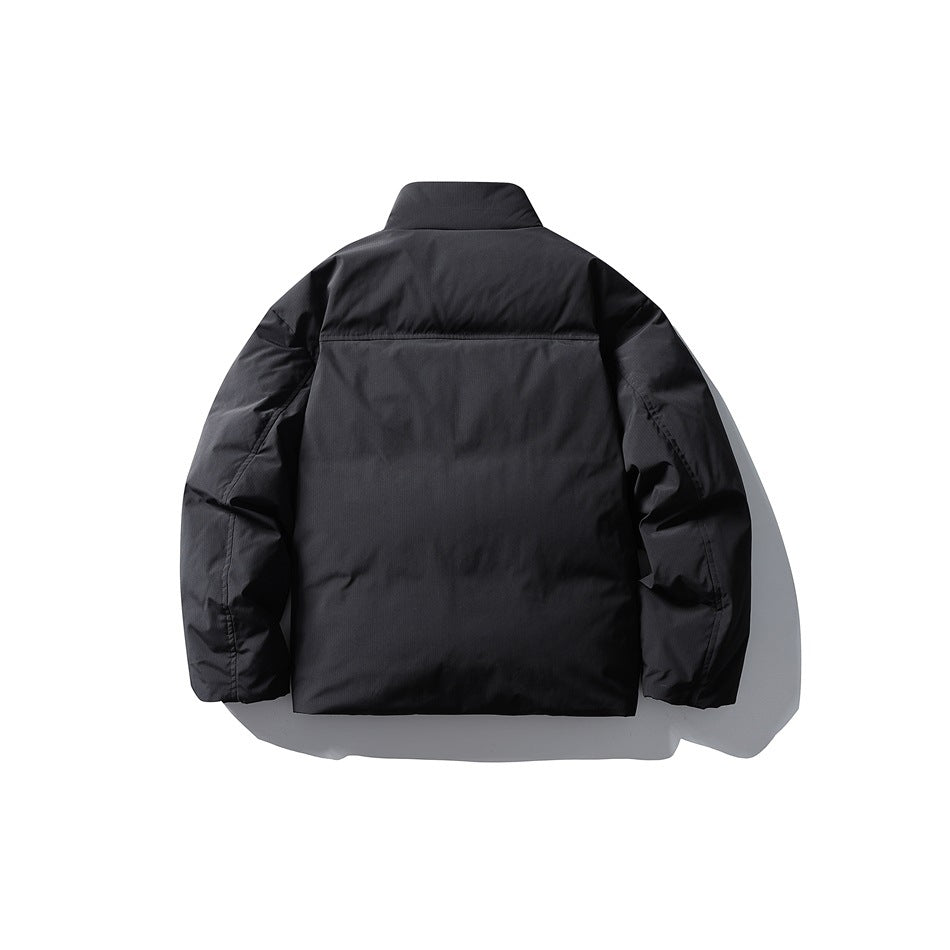 Back view of black puffer jacket with stand collar and horizontal yoke seam