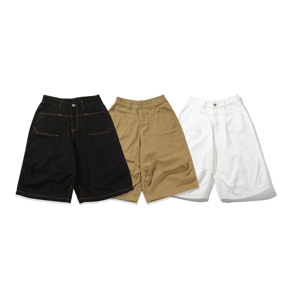 Three pairs of wide-leg shorts shown in black, tan, and white, with contrast stitching and front pockets.