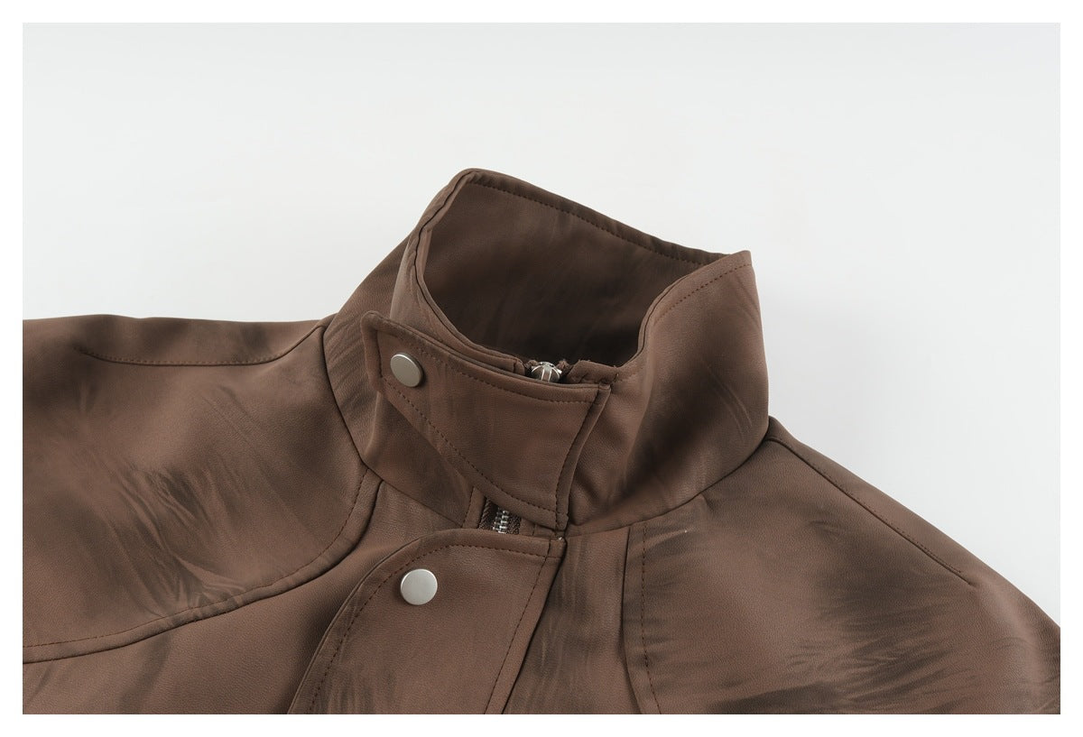 Close-up of the brown jacket's stand collar and snap-fastened front storm flap.