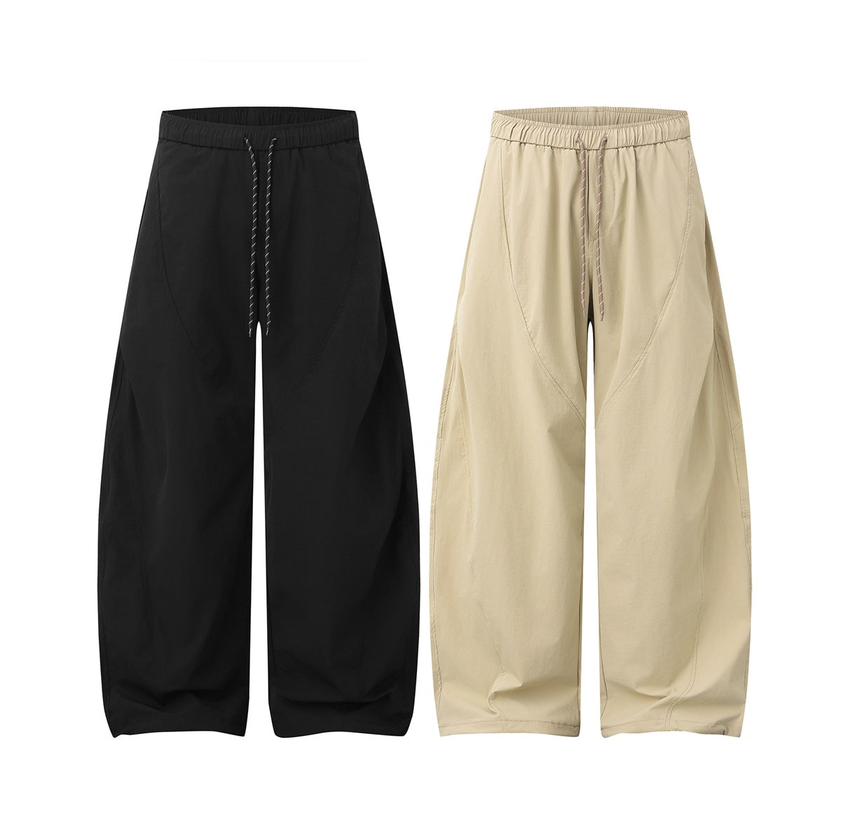 Front view of wide-leg pants in black and beige, each with an elastic drawstring waist and curved seams.