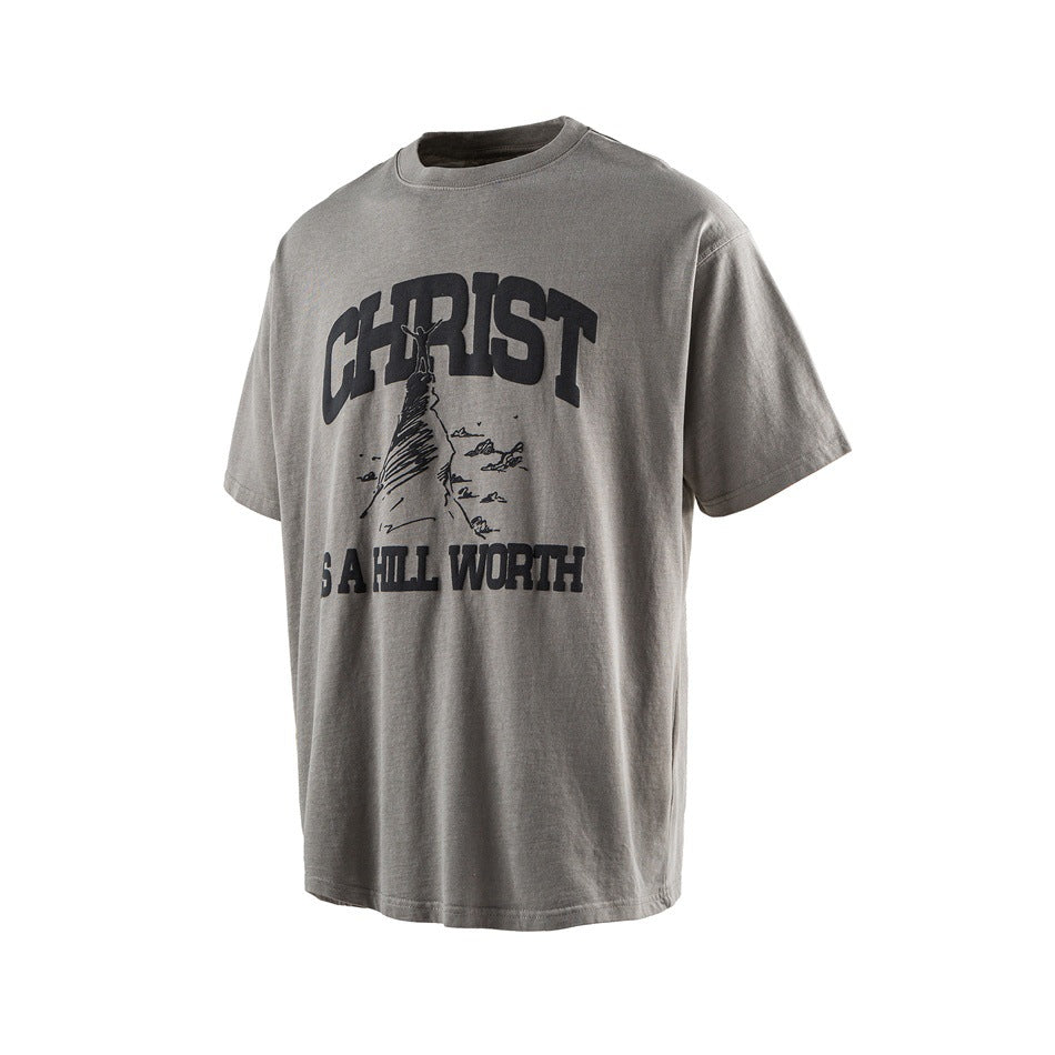 Gray short-sleeve T-shirt with a dark graphic of a climber and the words “CHRIST IS ALL WORTH.”