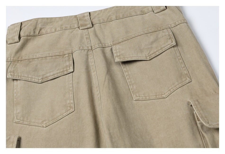 Close-up of the back of khaki cargo pants with two flap pockets and belt loops.