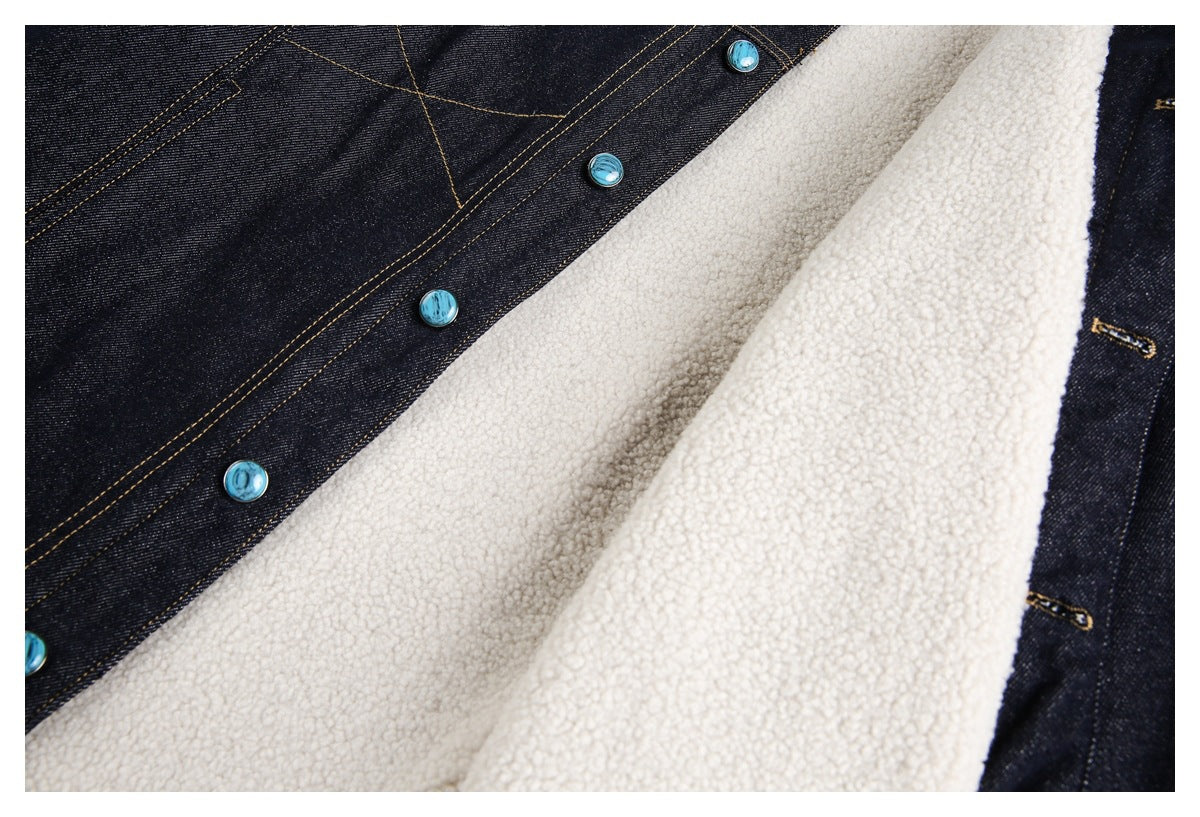 Close-up of the jacket's cream sherpa lining, dark denim edges, and turquoise buttons.