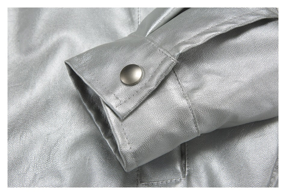 Close-up of the silver jacket's cuff with a round snap button.