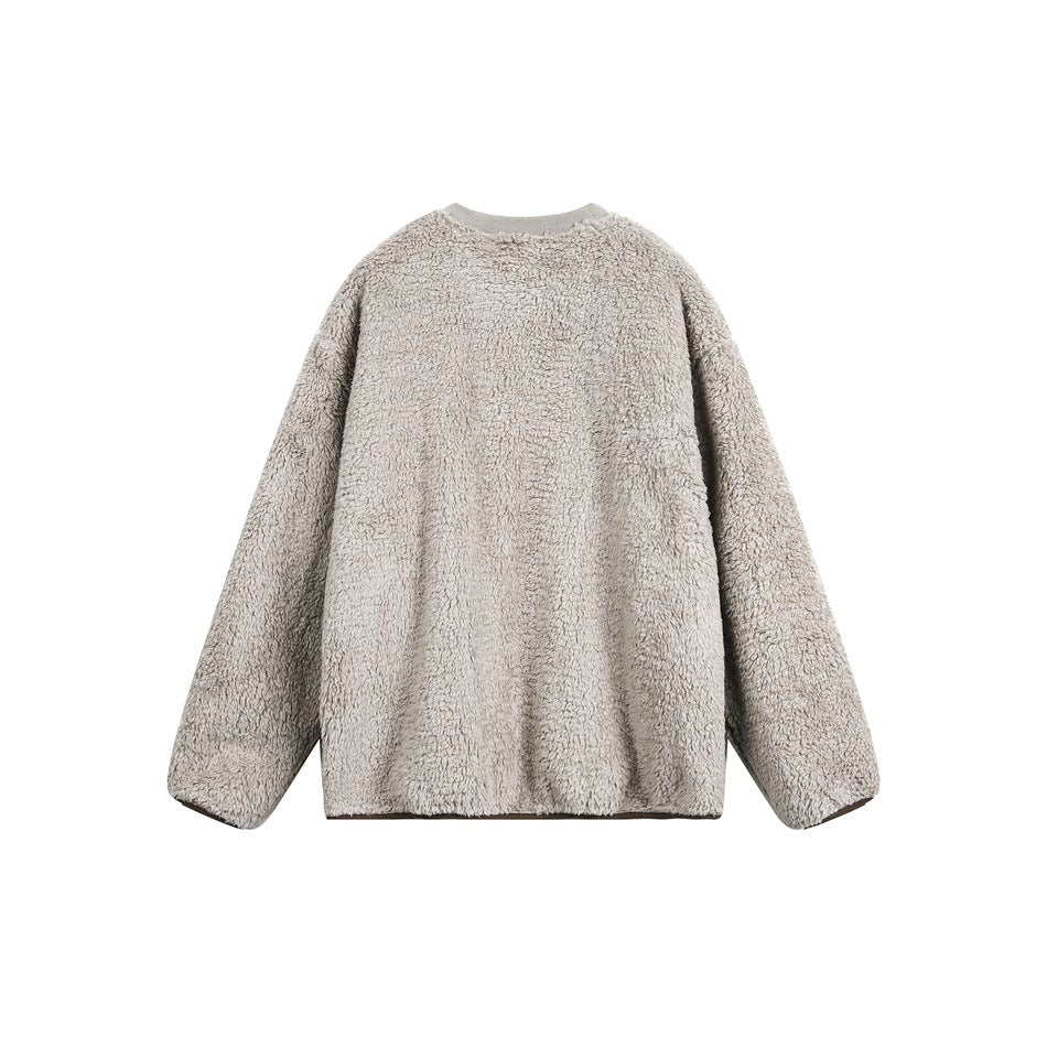 Front view of a beige-gray plush crewneck sweatshirt with long sleeves and a relaxed shape, shown flat against white.