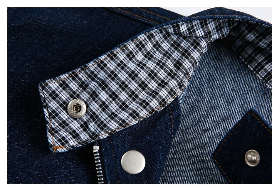 Close-up of the jacket collar opened to show its black-and-white checked lining and metal snaps.
