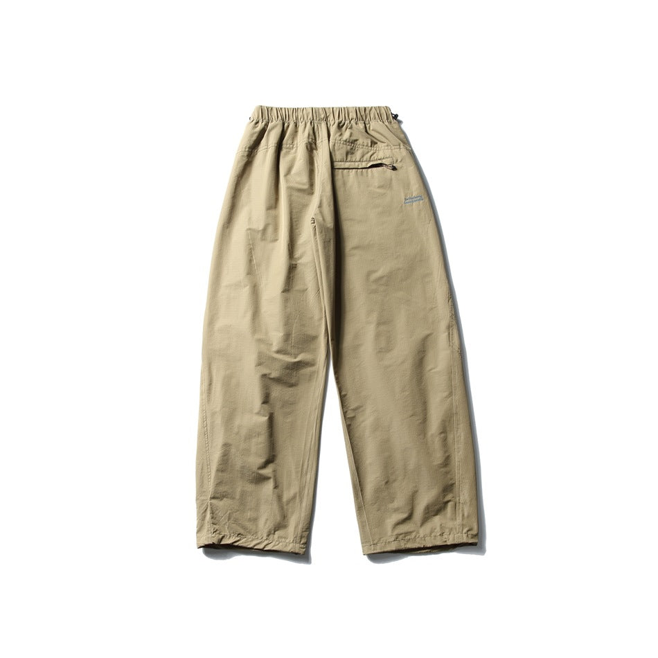 Khaki wide-leg pants laid flat, with an elastic waist and a small zip pocket at the back.