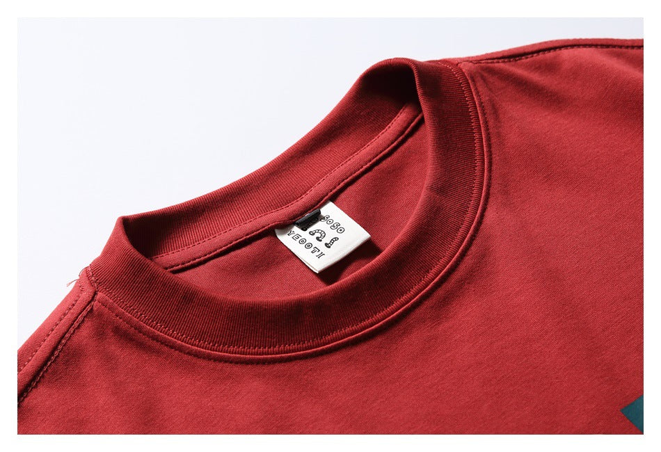 Close-up of the red T-shirt's ribbed crew neck and inside neck label.