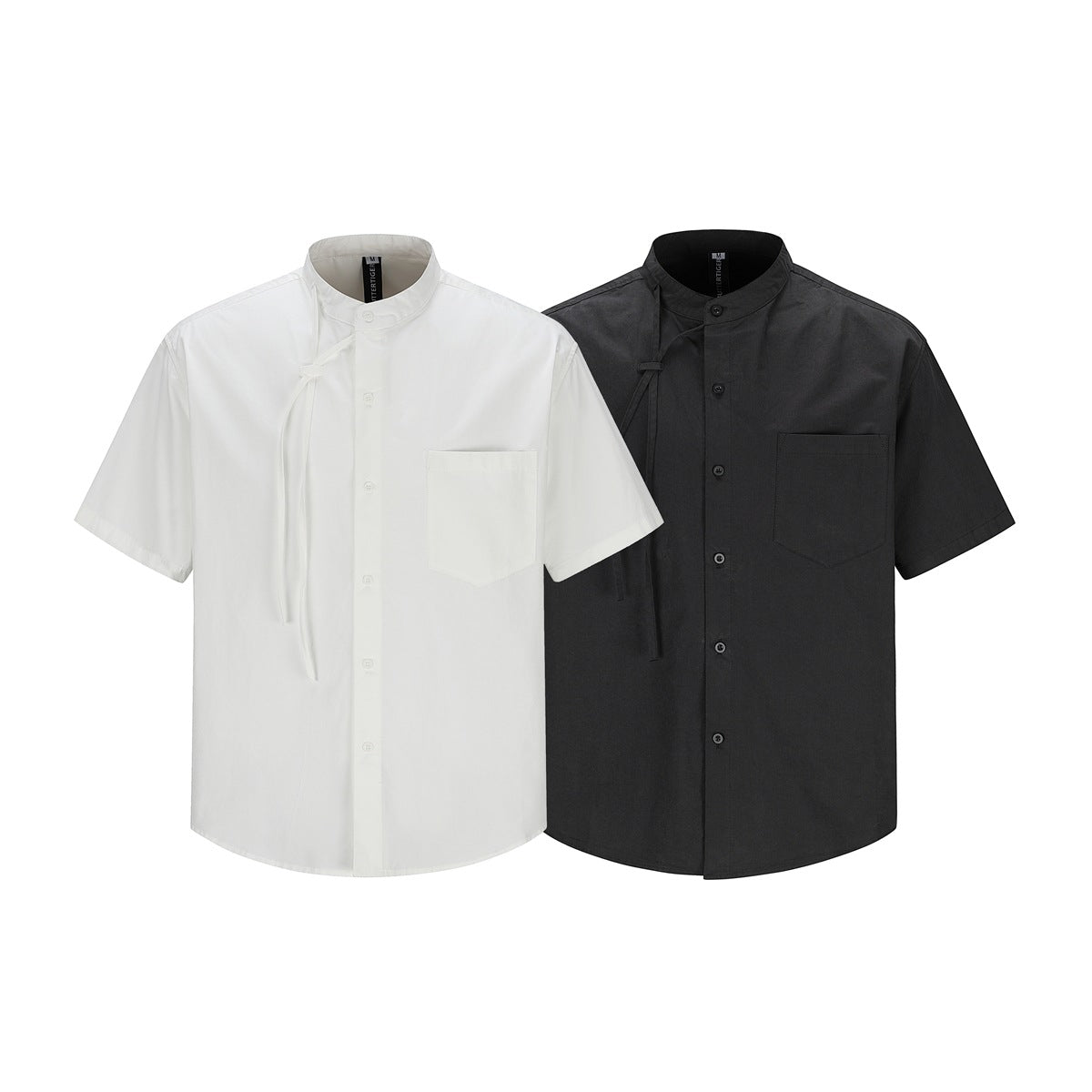 White and black short-sleeve shirts displayed from the front, with band collars, button fronts, and chest pockets.