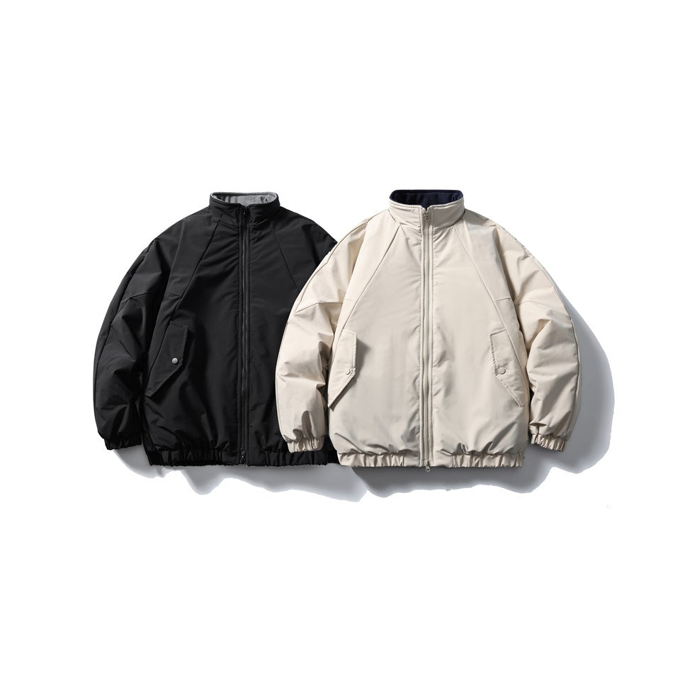 Black and light beige zip-front jackets shown side by side, each with a stand collar, snap-flap pockets, and elastic hems.