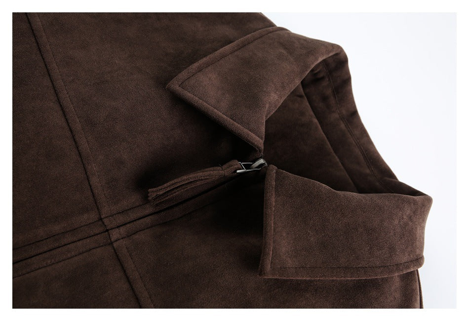 Close-up of a dark brown coat showing its wide collar, zipper, and buttoned cuff strap.