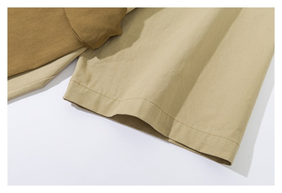 Close-up of a beige garment sleeve hem beside a section of brown fabric.