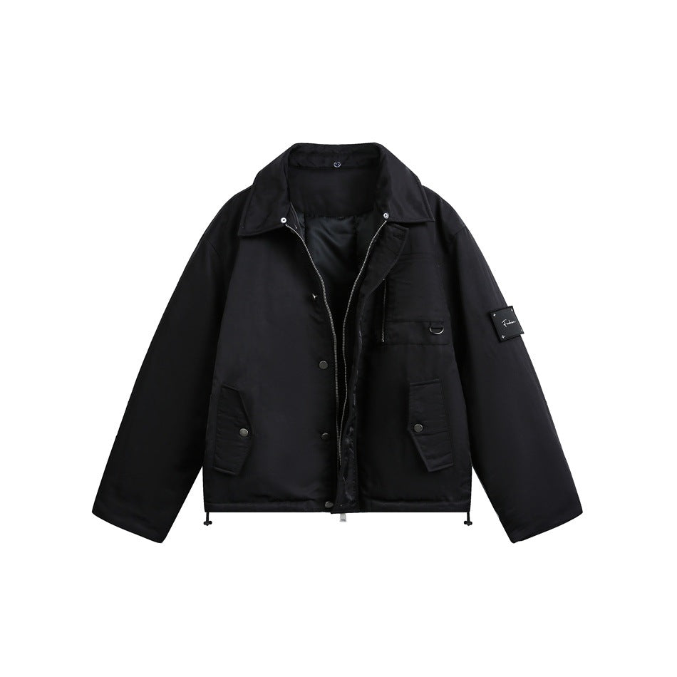 Front view of a black jacket with a pointed collar, zip closure, chest pocket and two flap pockets.