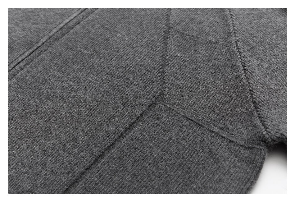 Close-up of gray knit fabric panels and their seam construction.