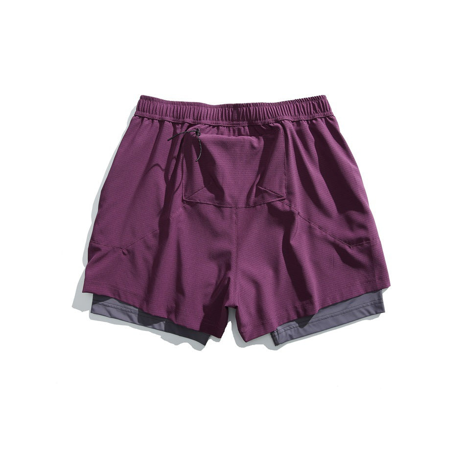 Purple running shorts shown flat from the back, with an elastic waistband, drawcord and central rear pocket.