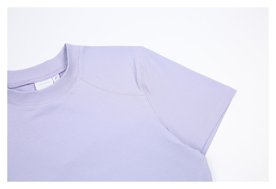 Close-up of the lavender shirt's crew neck, shoulder seams, and short sleeve.