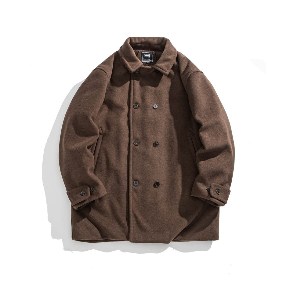 Brown double-breasted mid-length coat with turn-down collar, side pockets and button-tab cuffs, flat lay front view