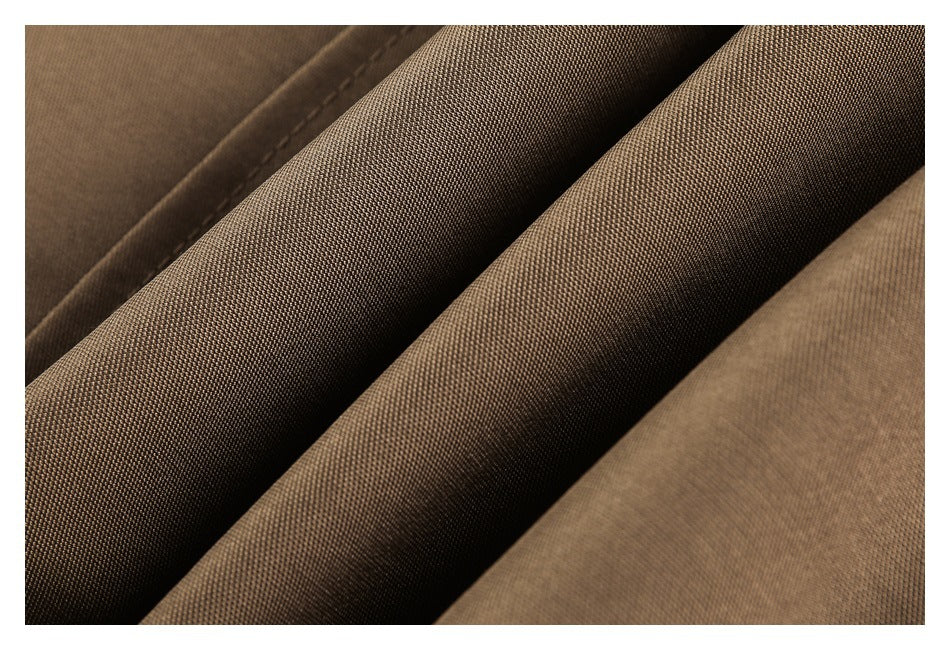 Close-up of brown woven garment fabric folded into ridges.