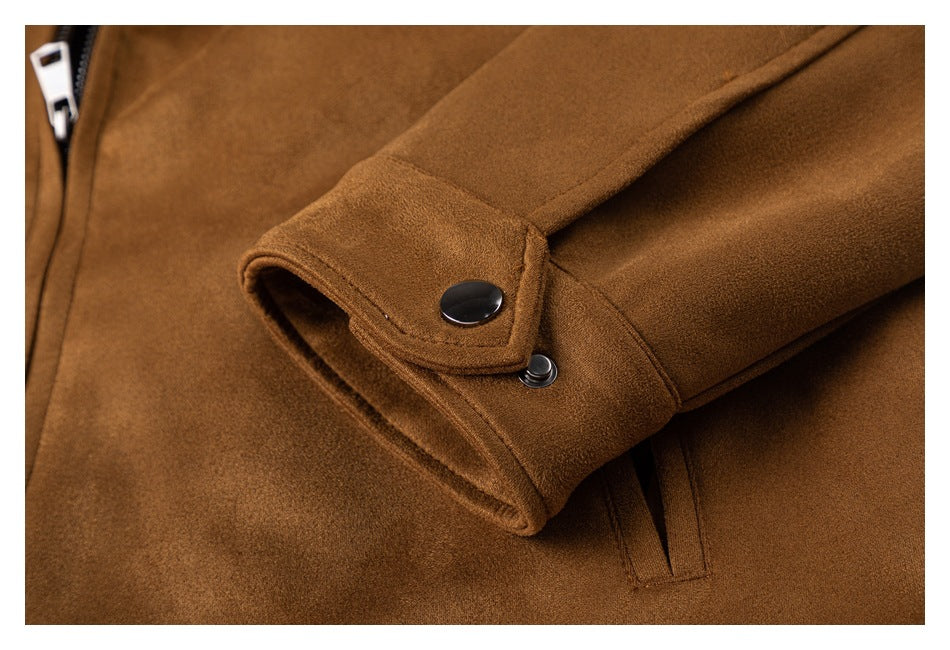 Close-up of a camel-brown sleeve cuff with a dark snap button.