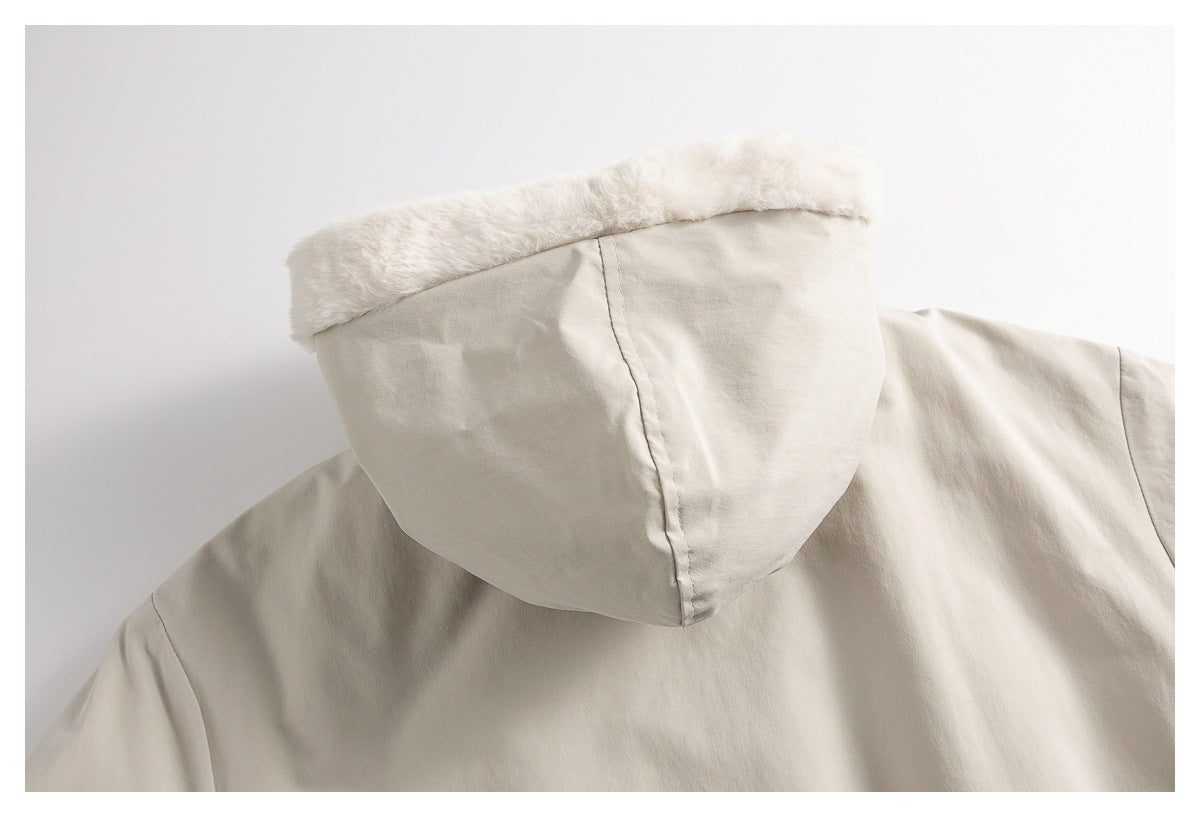 Close-up of a light beige hood with a plush pale trim.