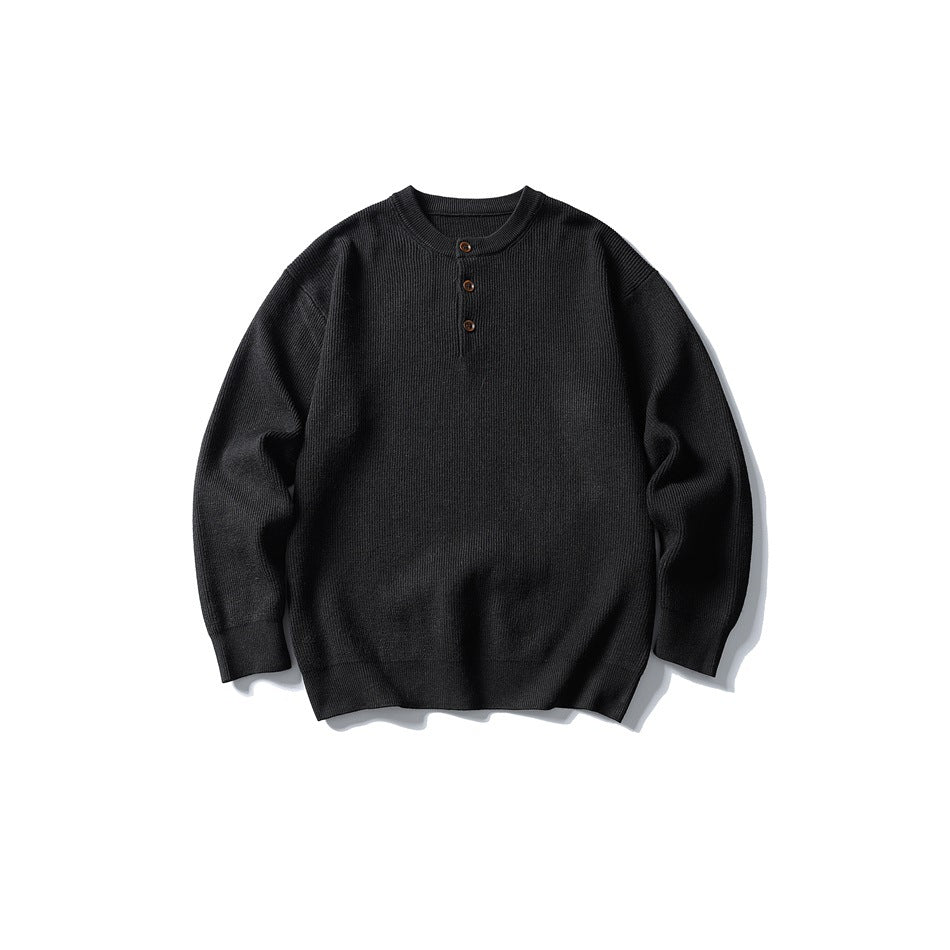 Black ribbed-knit Henley sweater with three buttons, flat lay front view