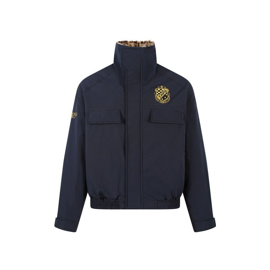 Navy blue bomber-style jacket with high collar, chest flap pockets, crest patch and elastic hem, front view