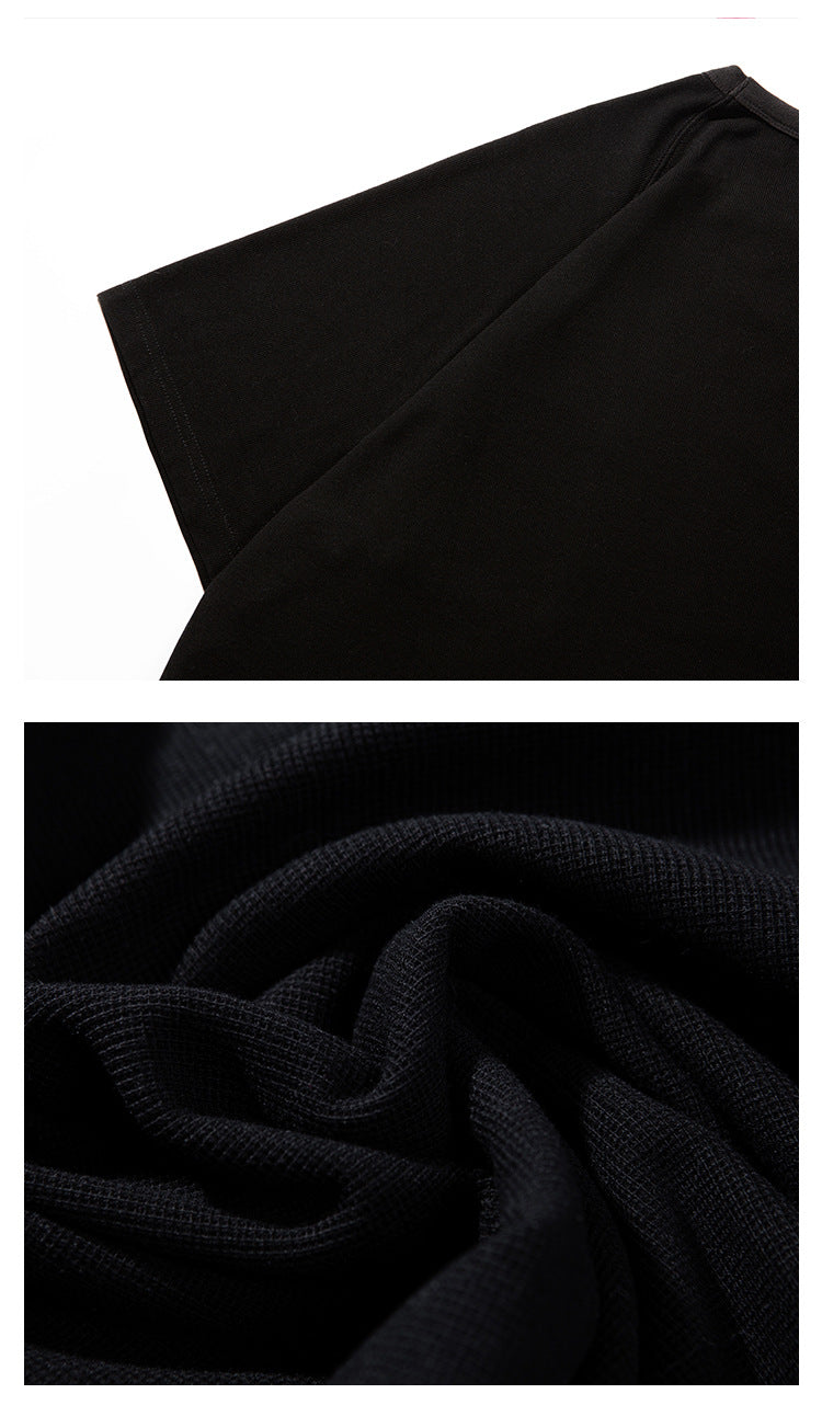 Close-up of a black T-shirt sleeve and a macro view of the fabric texture.