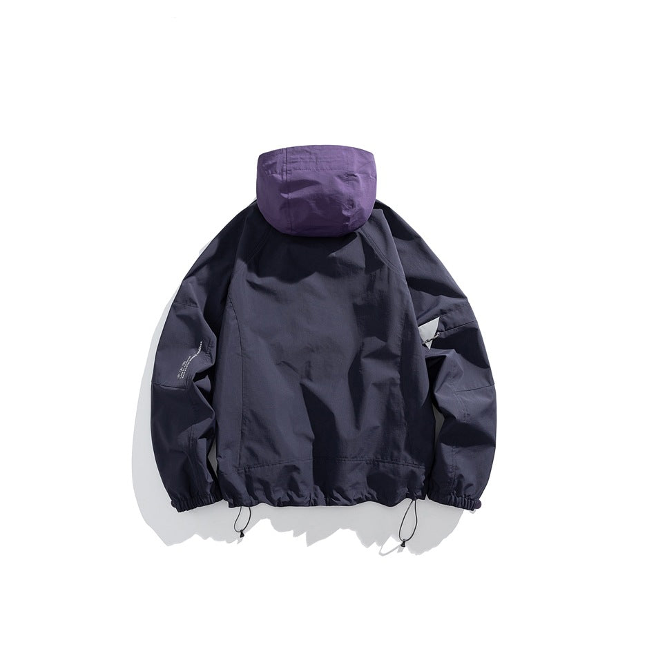 Back view of a dark navy hooded jacket with a purple hood, elastic cuffs, and adjustable hem cords.