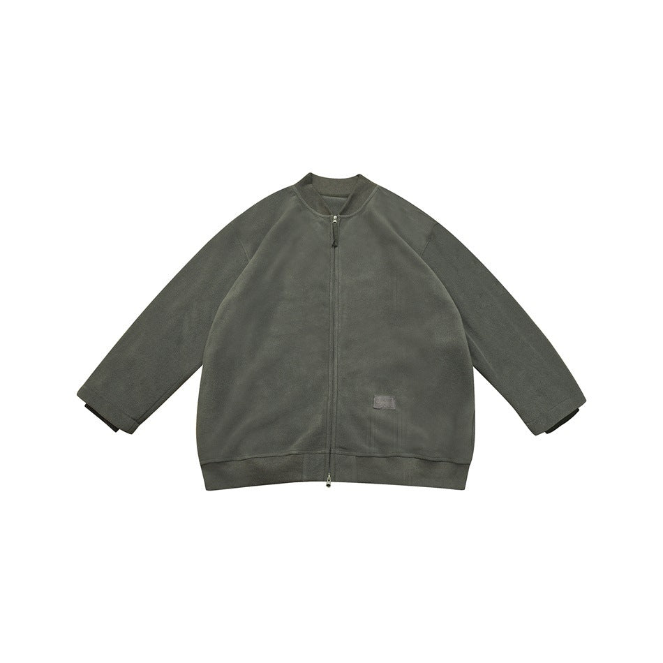 Gray-green zip-front fleece-like jacket with stand collar, ribbed hem and small front patch, flat view