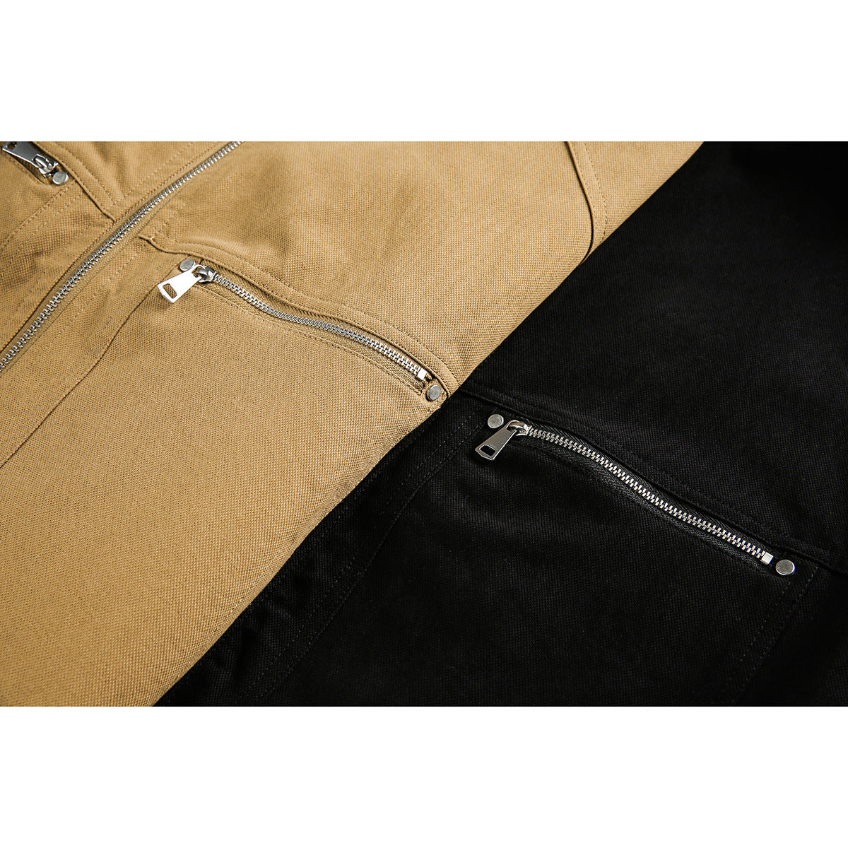 Close-up of tan and black jackets with diagonal silver zip pockets.