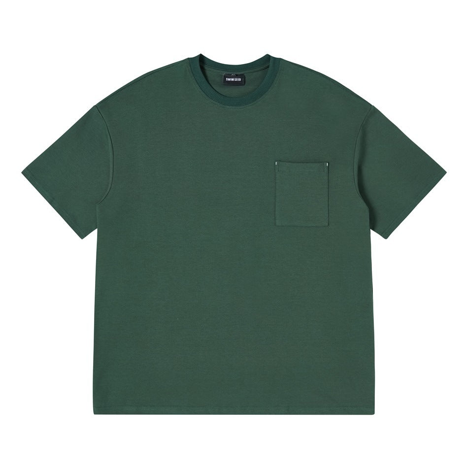 Front view of a dark green short-sleeve crew-neck T-shirt with a square chest pocket, laid flat.