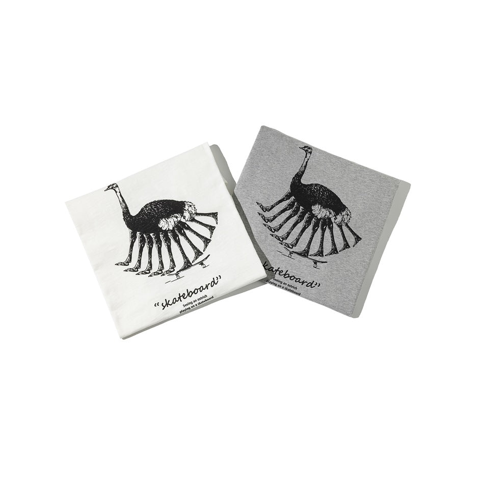 Folded white and heather-gray T-shirts display matching black ostrich skateboard graphics and English text.